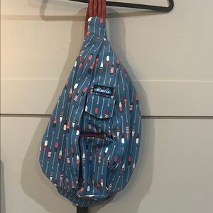 Kavu Paddle Pattern Sling Bag in Blue and Red